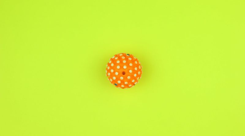 orange and white polka dot round ornament