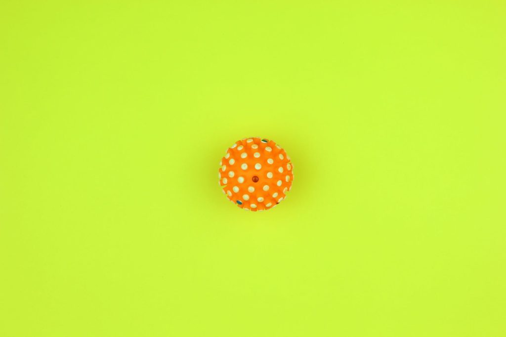 orange and white polka dot round ornament